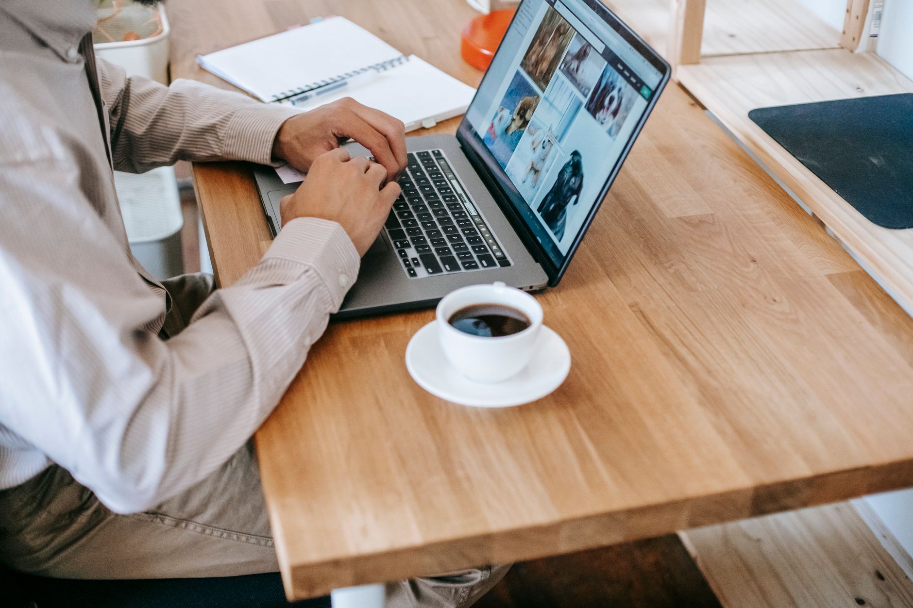 faceless guy remote worker using netbook in room